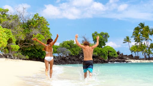 Summer fun beach couple running of joy banner with arms up in success on travel holidays. Happy people on tropical landscape background panoramic copy space.