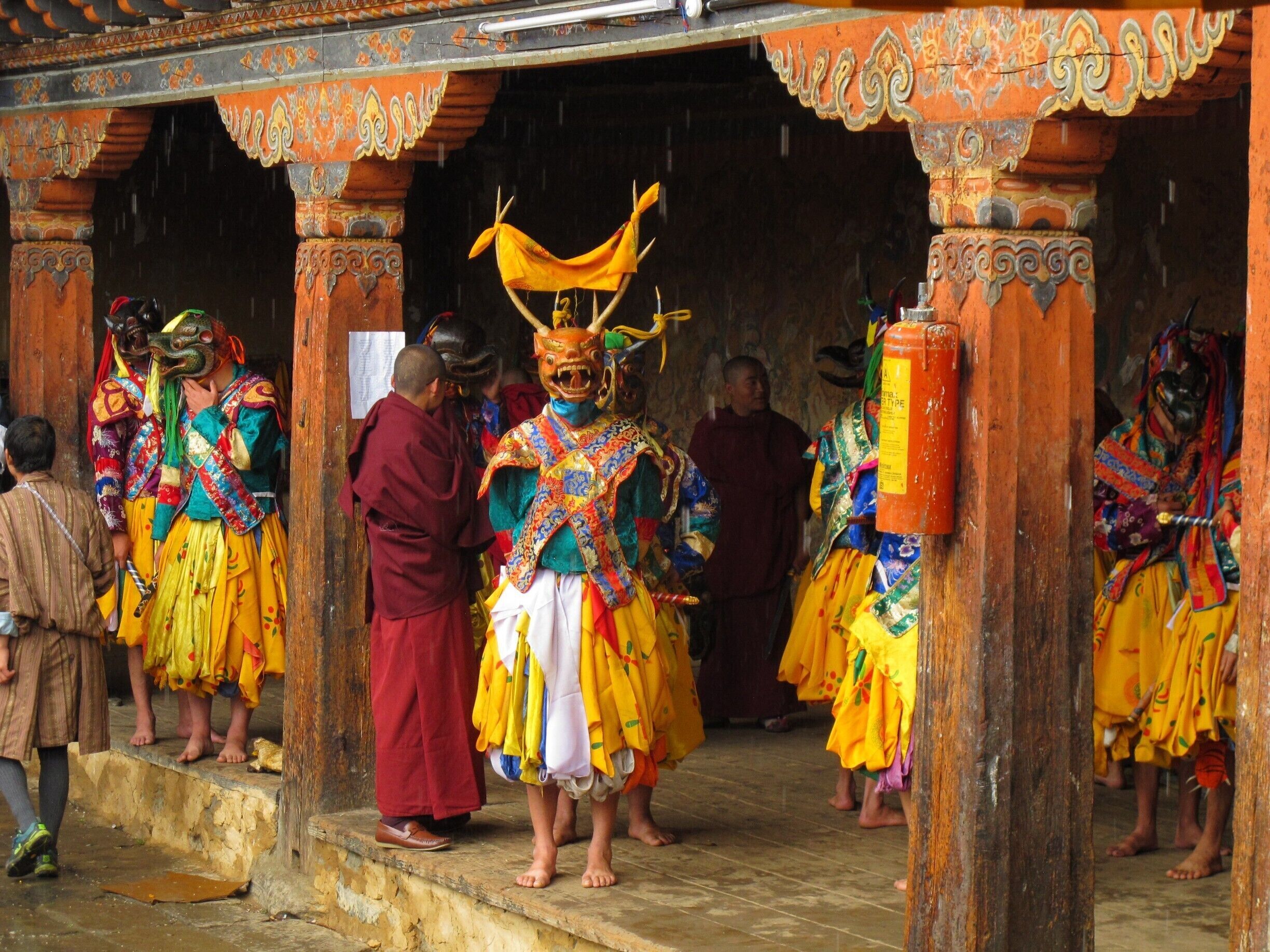 A traditional ceremony with colorful costumes and ornate architecture.