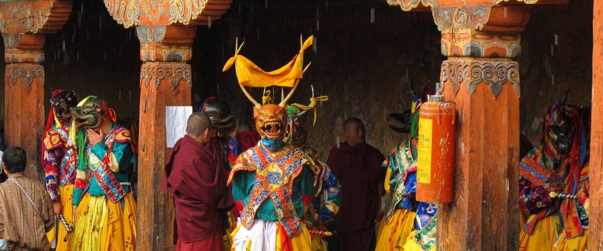 A traditional ceremony with colorful costumes and ornate architecture.