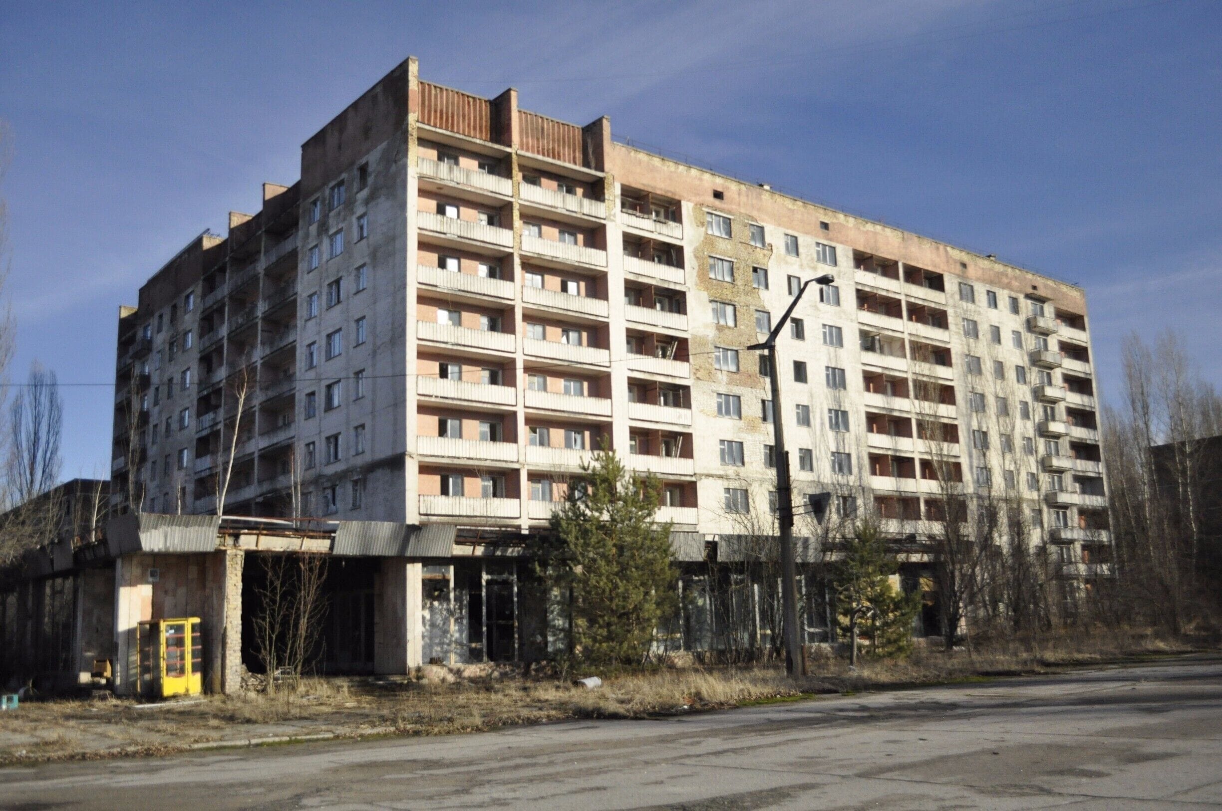 Residential block at the edge of Lenin Square (complete with yellow phone box on the left)

see my blog post for more information www.greengoulash.com/chernobyl

#chernobyl #darktourism 
#Abandoned