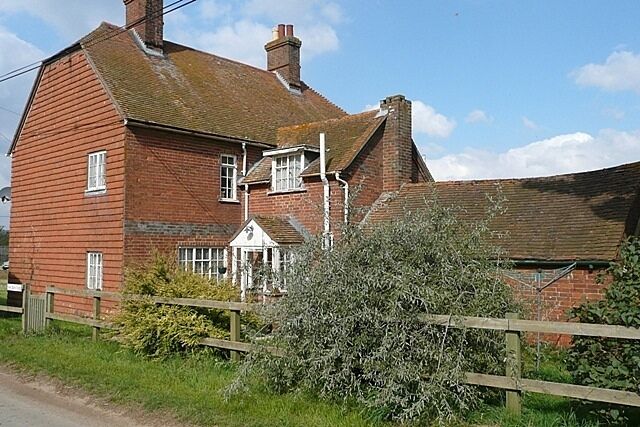 New Barn Farm The tile-clad farmhouse on the Bucklebury Road north of the River Pang.