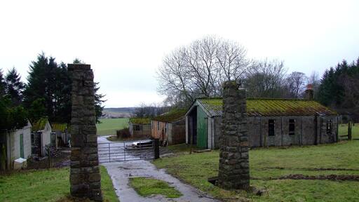 Gateposts and Huts at Stuartfield POW Camp The old gateposts at the old prisoner of war camp at Stuartfield in Aberdeenshire remain, as do some of the now derelict huts. Stuartfield initially housed Italian POW's, but later interred captured German soldiers, some from the 12th Panzer Division, after they were taken prisoner at Caen in France. Post war saw the camp being used to house displaced persons, from the likes of Bulgaria and Hungary.