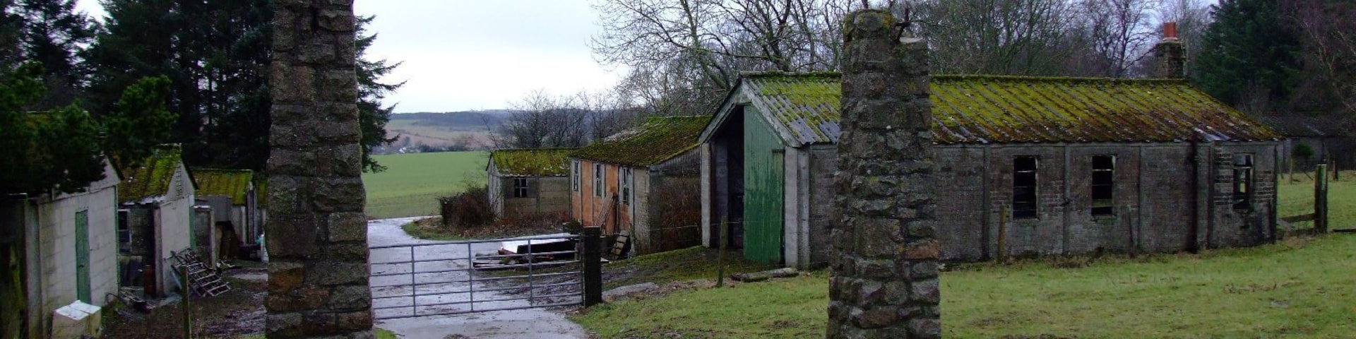 Gateposts and Huts at Stuartfield POW Camp The old gateposts at the old prisoner of war camp at Stuartfield in Aberdeenshire remain, as do some of the now derelict huts. Stuartfield initially housed Italian POW's, but later interred captured German soldiers, some from the 12th Panzer Division, after they were taken prisoner at Caen in France. Post war saw the camp being used to house displaced persons, from the likes of Bulgaria and Hungary.