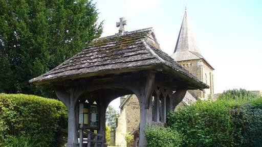 Lych Gate, Ewhurst Outside St Peter and St Paul, the lych gate is roofed with "Horsham Flags", local stone.