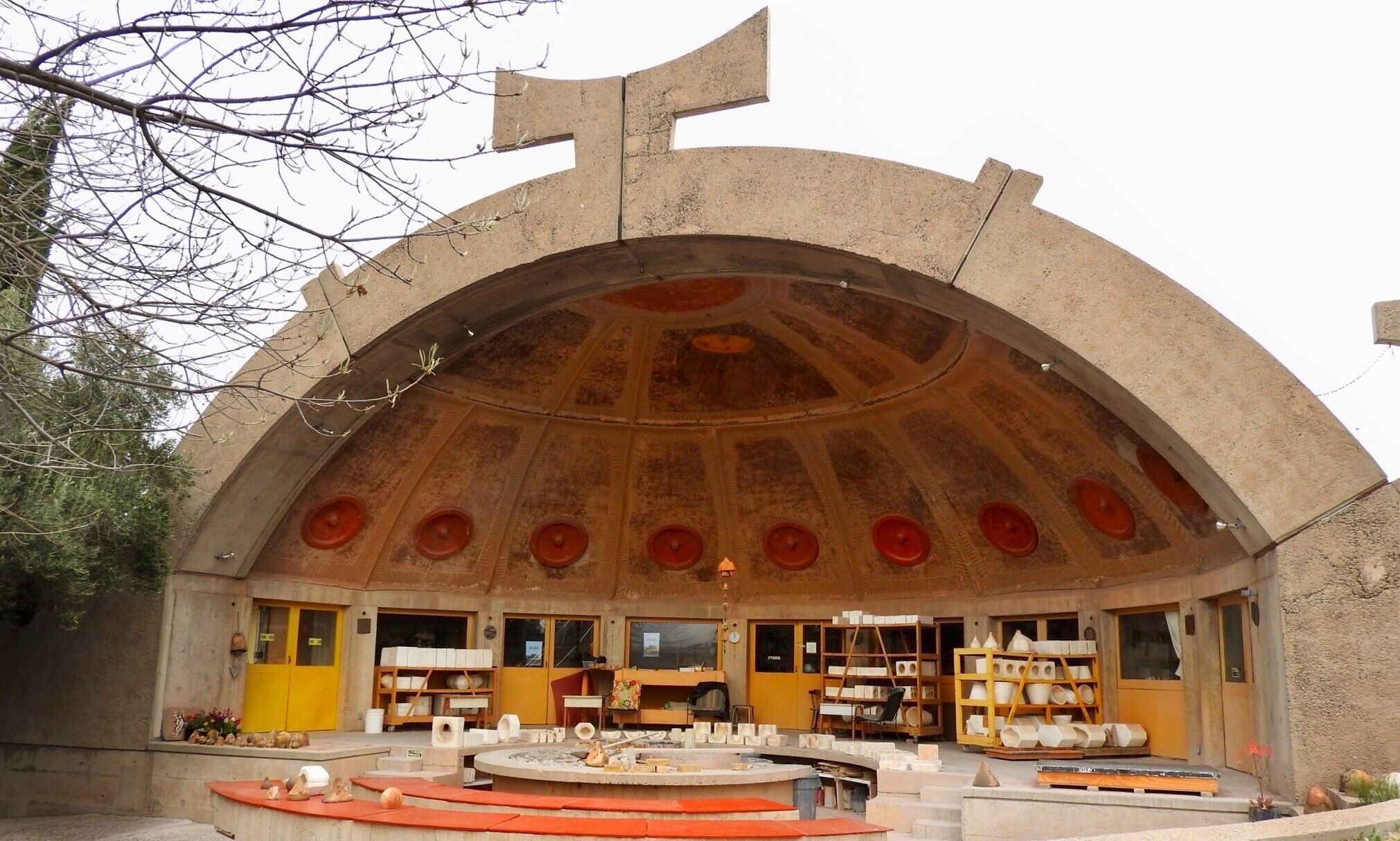 Arcosanti is a projected experimental town with a molten bronze bell casting business in Yavapai County, central Arizona, 70 mi north of Phoenix, at an elevation of 3,732 feet. Its arcology concept was posited by the Italian-American architect, Paolo Soleri. This image shows the ceramic workshop. Wikipedia

#Arcosanti #Arizona #Soleri