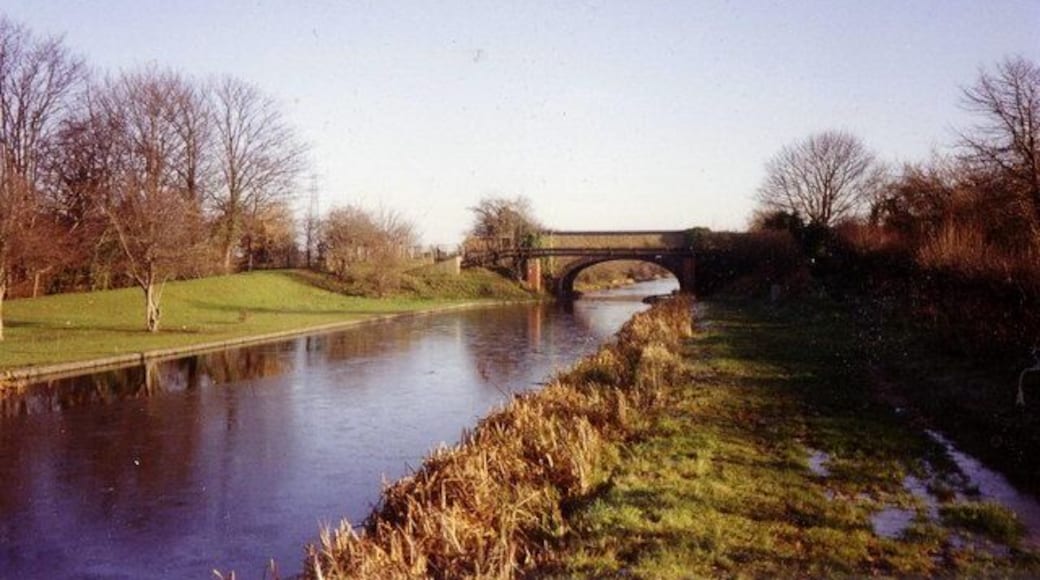 Grand Union Canal, Slough arm. A view eastwards along a boggy towpath towards the bridge carrying Middlegreen Road over the canal.