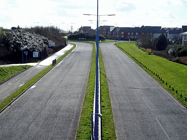 Looking south along Great Stoke Way Taken from the footbridge looking south. At this time of day this road is extremely quiet (given its size), but I don't know what it is like at rush hour.