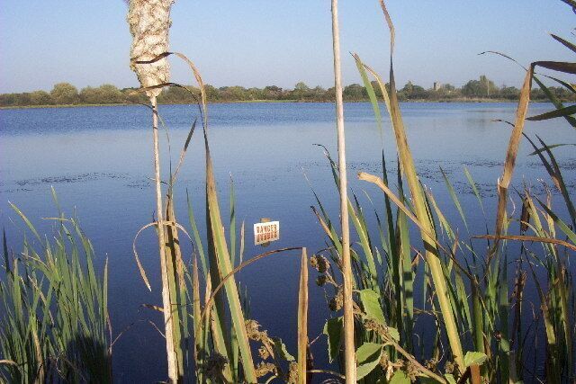 near to Barrow on Trent. View over a now-disused gravel pit south west of Barrow on Trent, now a lagoon used by local and migratory wildlife. Barrow church is in the distance.