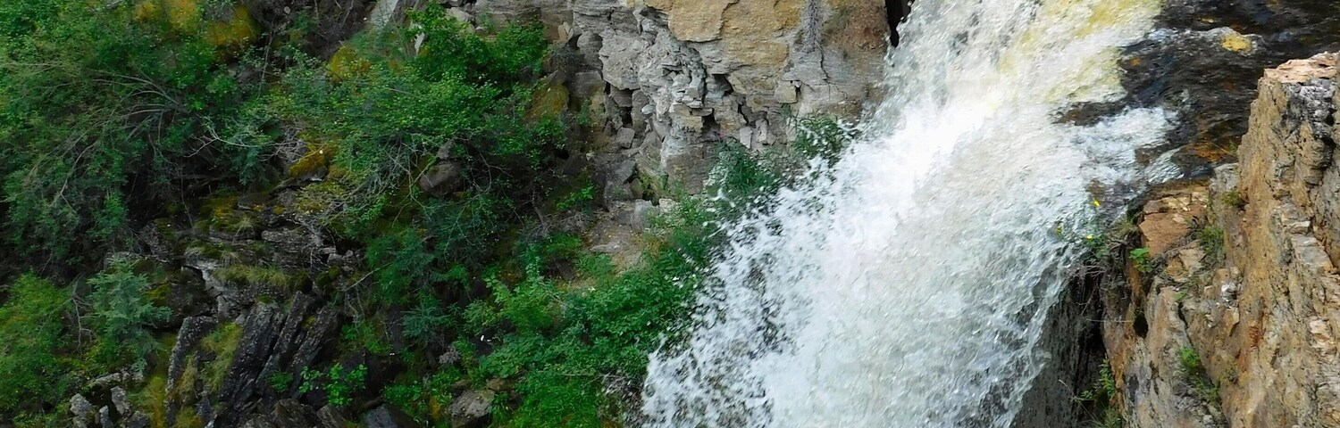 A gorgeous waterfall just off a creek, and right alongside the highway.