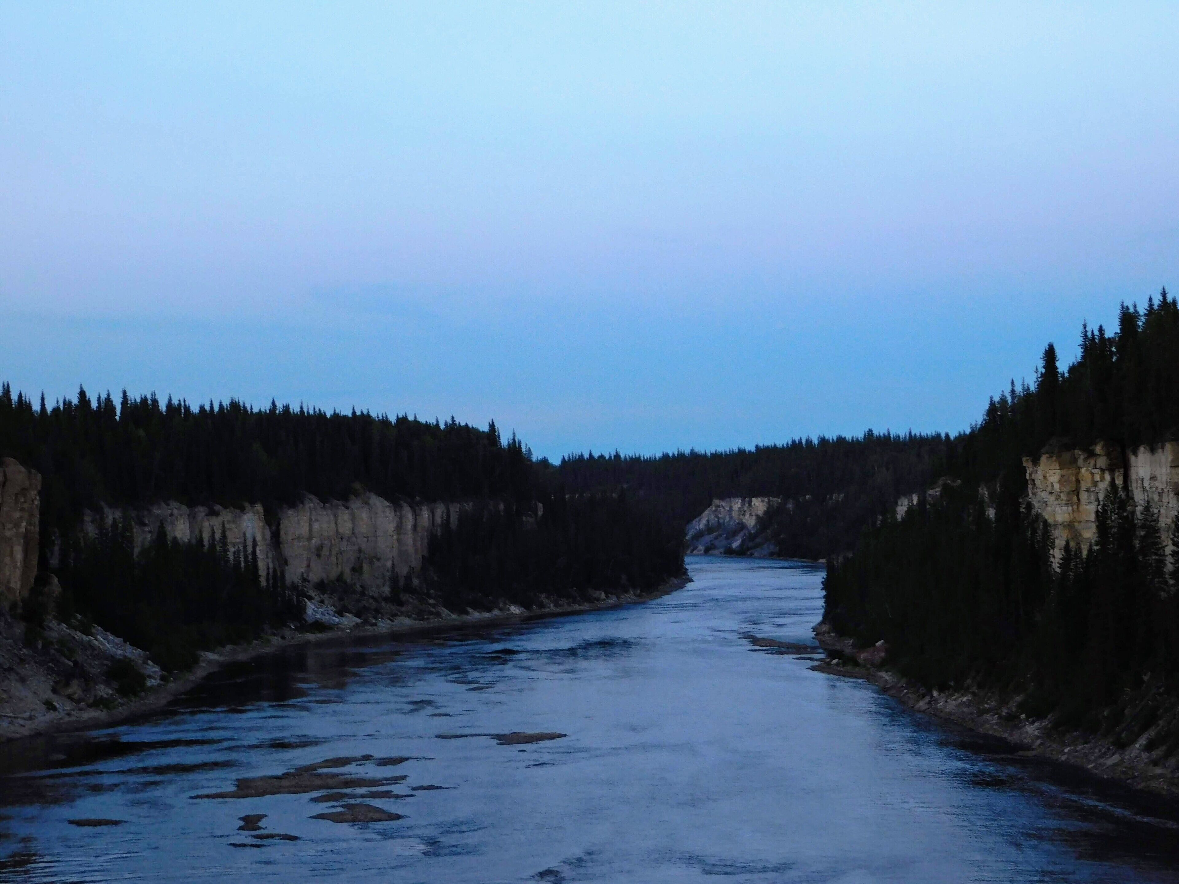 The view of the river beyond the falls.
