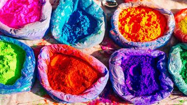 Multiple bags filled with colorful powders.