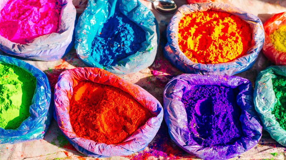 Multiple bags filled with colorful powders.
