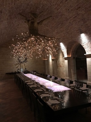 One of the most grand dining rooms ever in the amazing wine cave at Hall Rutherford. The chandelier is out of this world!
