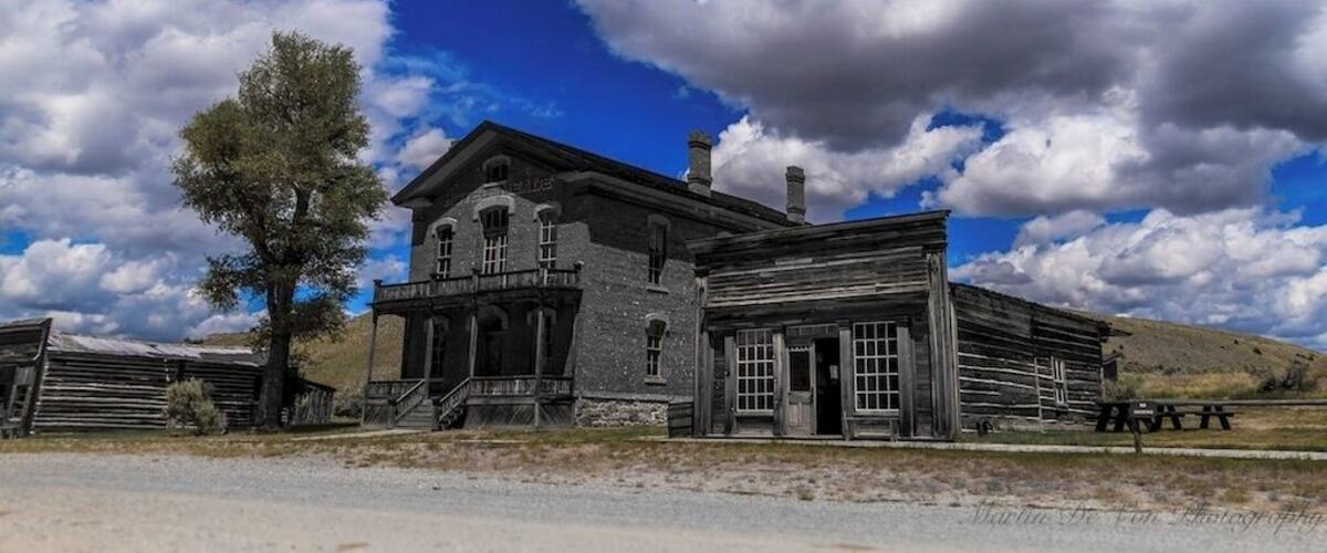 Skinner's Saloon - This building, originally built on Yankee Flats was moved to Bannack in 1863. Owned by Cyrus Skinner, a known outlaw and suspected gang member of the Innocents Gang, the saloon quickly became one of the wildest places in town. During its heydays, there were a number of shootouts in the saloon, including one where a bullet went astray, punched through the wall, and killed a woman across the street. On another occasion, two gamblers in a dispute, drew their guns and blasted rounds at each other. Though neither gambler was killed, a bullet killed a drunk man who was passed out on the floor.