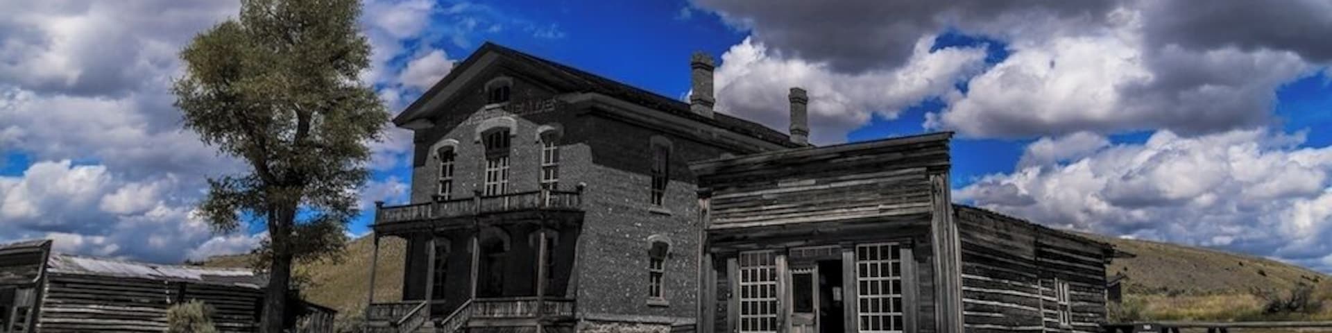 Skinner's Saloon - This building, originally built on Yankee Flats was moved to Bannack in 1863. Owned by Cyrus Skinner, a known outlaw and suspected gang member of the Innocents Gang, the saloon quickly became one of the wildest places in town. During its heydays, there were a number of shootouts in the saloon, including one where a bullet went astray, punched through the wall, and killed a woman across the street. On another occasion, two gamblers in a dispute, drew their guns and blasted rounds at each other. Though neither gambler was killed, a bullet killed a drunk man who was passed out on the floor.