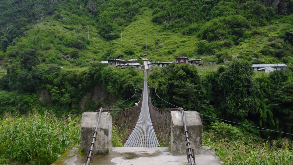 Long suspension bridge to Ngadi. Bridge across Marsyangdi river on the Annapurna circuit.