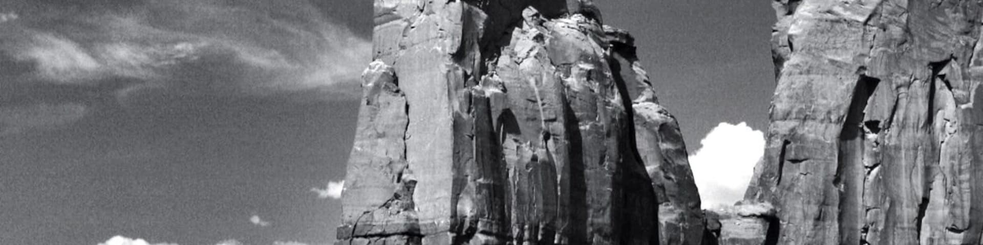 Giant stone pillars are everywhere in monument valley national park.
This great valley boasts sandstone masterpieces that tower at heights of 400 to 1,000 feet. framed by scenic clouds casting shadows that graciously roam the desert floor. The angle of the sun accents these graceful formations, providing scenery that is simply spellbinding.
The landscape overwhelms, not just by its beauty but also by its size. The fragile pinnacles of rock are surrounded by miles of mesas and buttes, shrubs, trees and windblown sand, all comprising the magnificent colors of the valley. All of this harmoniously combines to make Monument Valley a truly wondrous experience. Enjoy this beautiful land.