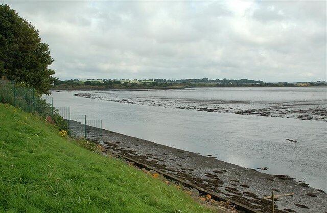 The Eden Estuary Local Nature Reserve. Viewed from the Eden Estuary Centre at Guardbridge, at low tide. There's often a Kingfisher perched on the post in the foreground. For a high tide view in better weather, see 724648. The buildings on the other side, out of the square, are part of RAF Leuchars.