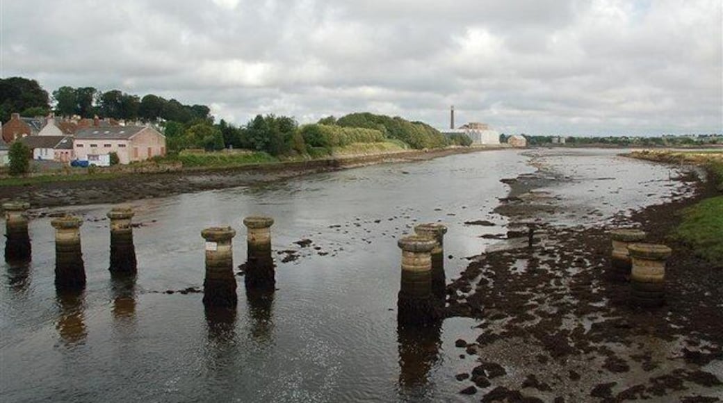 Crossing The Eden Estuary The pillars mark the position of the old railway bridge, built in 1852 by Thomas Bouch. He was made infamous in 1879 by the collapse of the Tay Railway Bridge, which he also engineered. The railway was closed in 1969. The factory in the background, and in the next square, is the paper mill operated by Curtis Fine Papers.