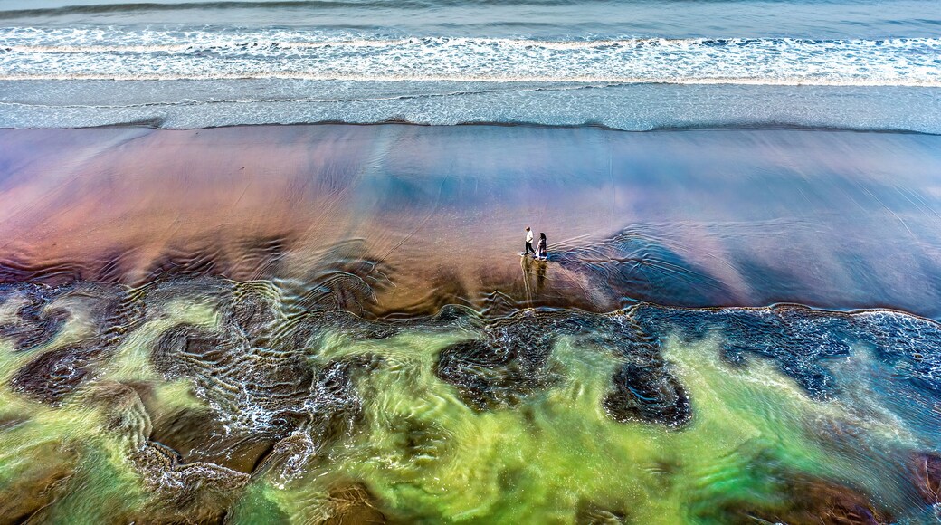 Aerial view of serene Kolatoli Beach with calm waves and vibrant sand, Cox's Bazar, Chattogram, Bangladesh.