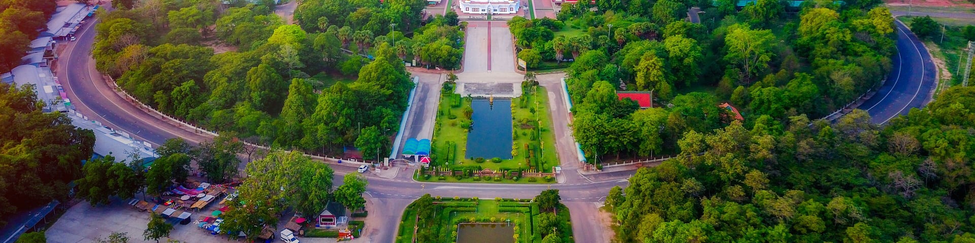 Aerial view of Phra That Nadoon or Wat Na Dun Pagoda at sunrise, Beautiful landmark and famous holy Buddha place in Maha Sarakham, Thailand.