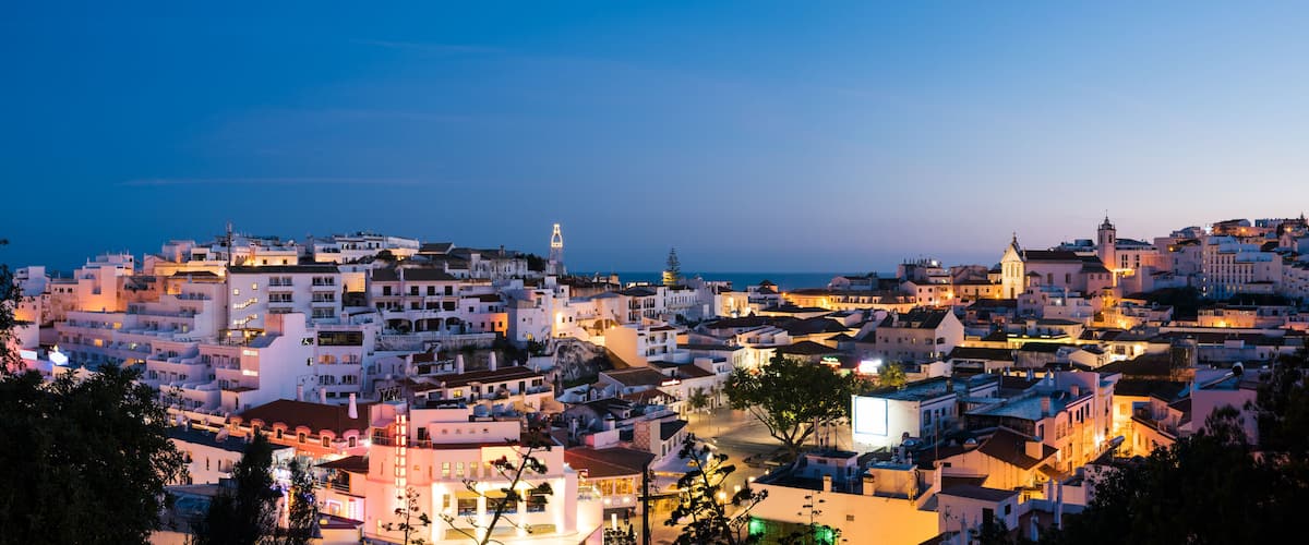Panoramic, night view of the Old Town of Albufeira City in Algarve, Portugal. Albufeira is a coastal city in the southern Algarve region of Portugal.