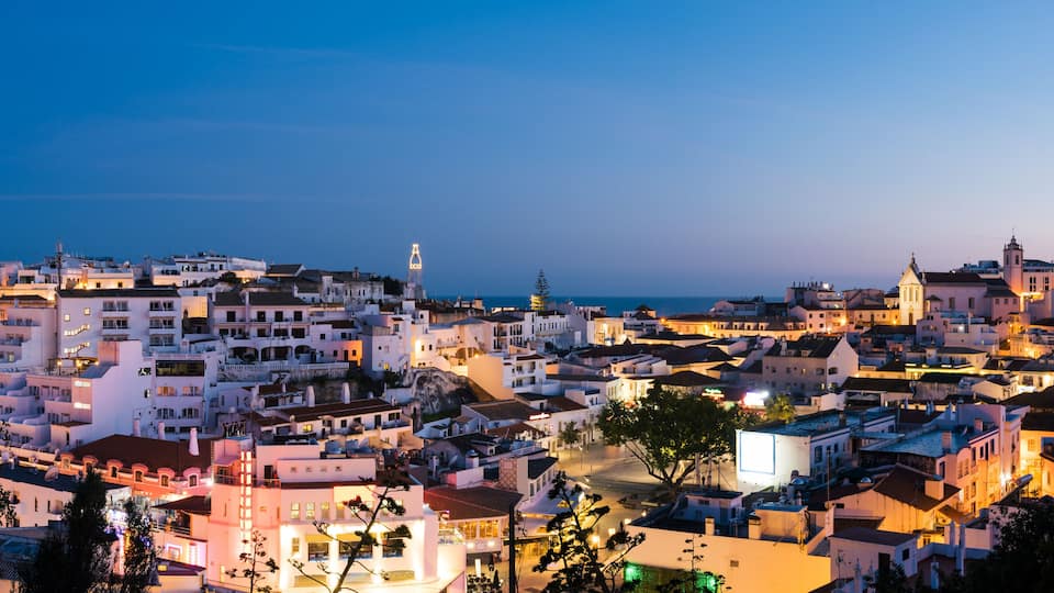 Panoramic, night view of the Old Town of Albufeira City in Algarve, Portugal. Albufeira is a coastal city in the southern Algarve region of Portugal.