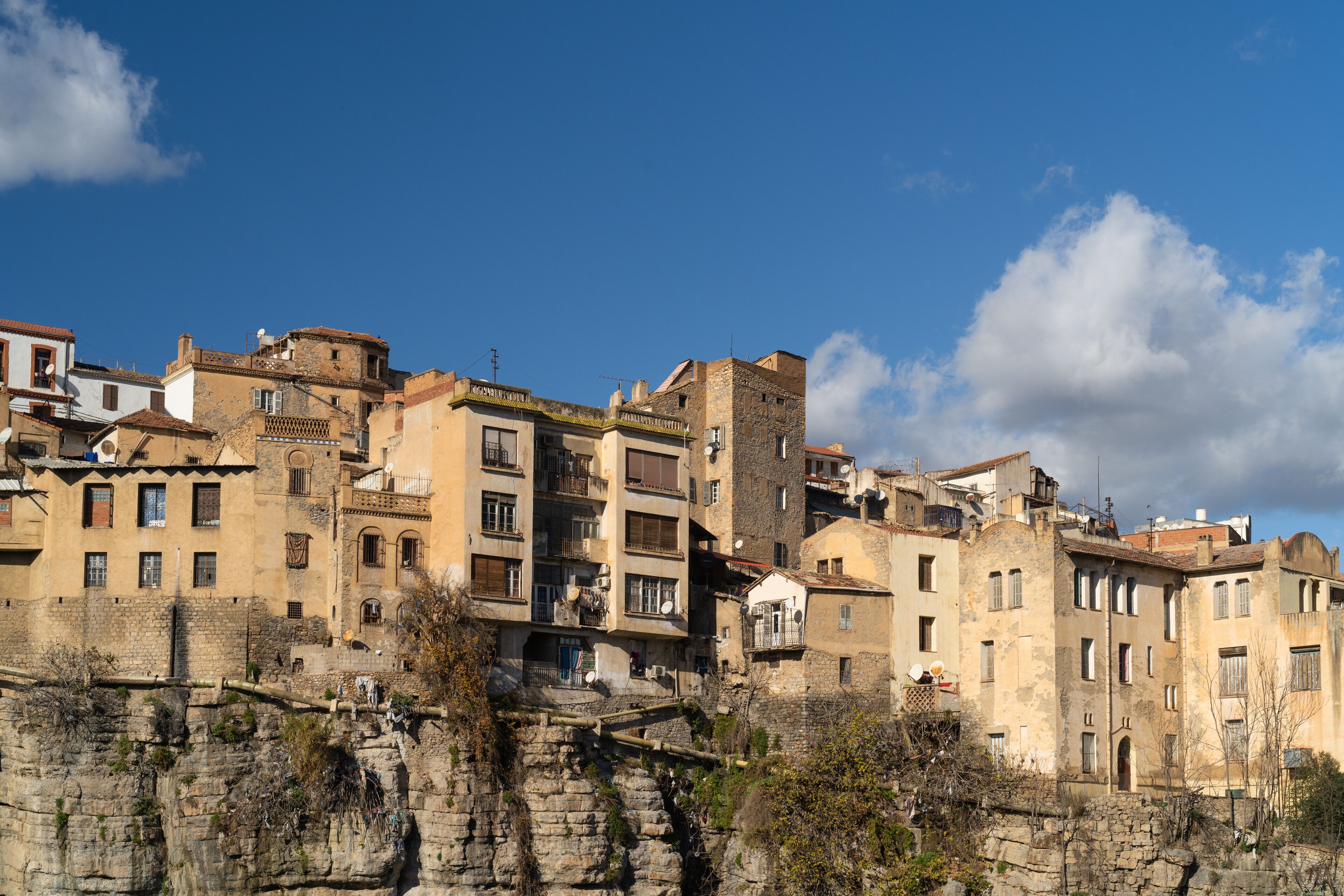 A historic town with stone buildings and a river.