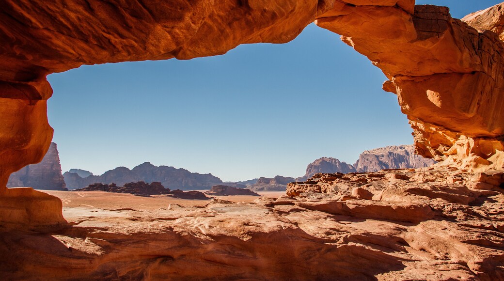 Framed view of Wadi Rum desert from Little Bridge rock formation, Jordan