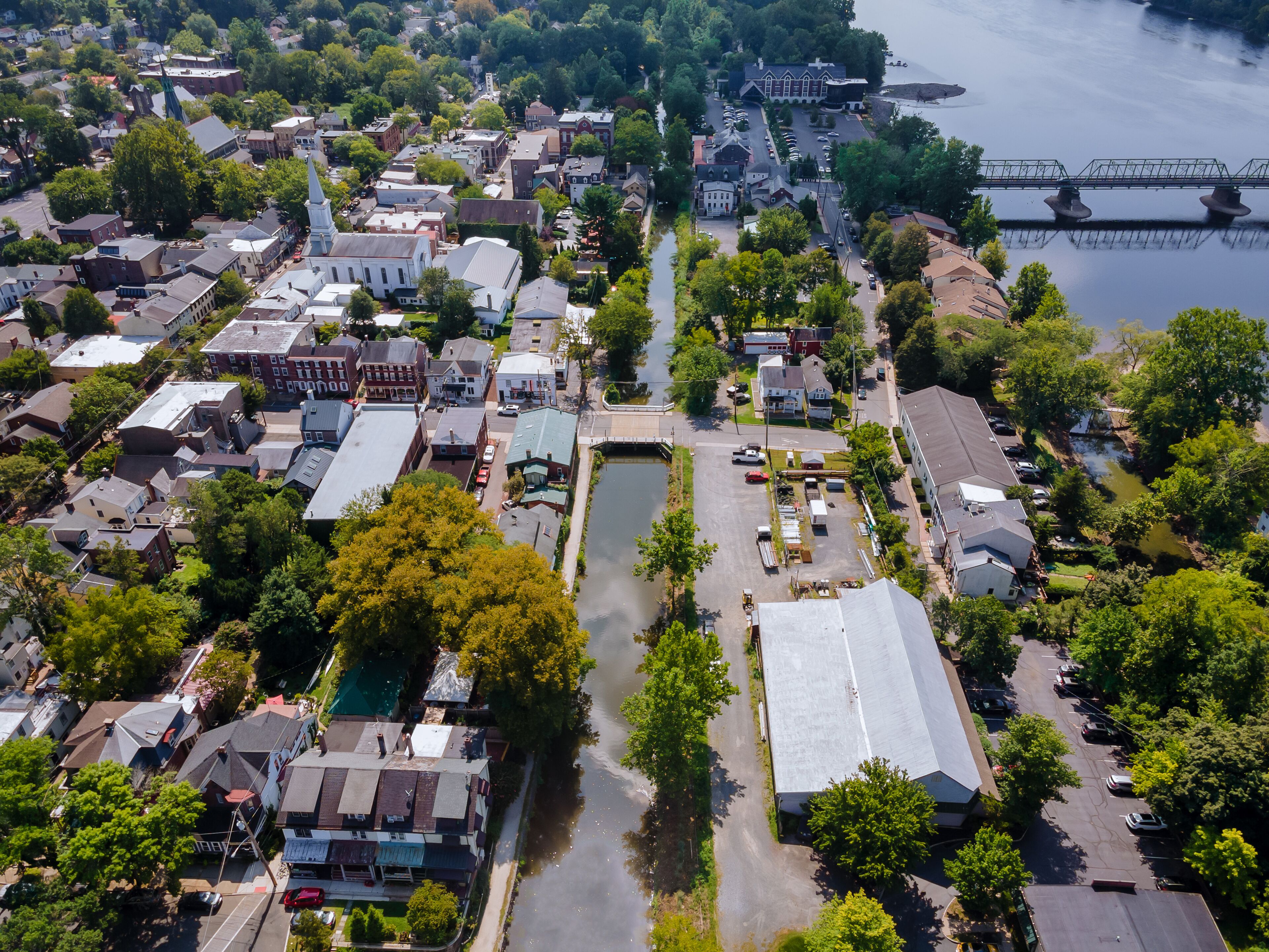 Overhead view of Delaware river aerial landscape of small town Lambertville New Jersey with historic city New Hope Pennsylvania USA