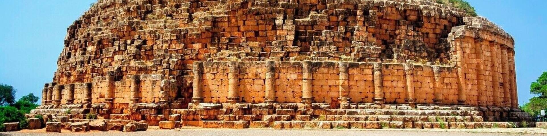 This lost pyramid in northern Africa is the burial tomb of Numidian king Juba II and his wife, Cleopatra Selene II (daughter of Cleopatra of Egypt and Mark Antony). Due to its poor maintenance, it is currently on the list of endangered UNESCO World Heritage Sites.
Access to the site is off the highway between Algiers and the nearby Roman city of Tipaza.