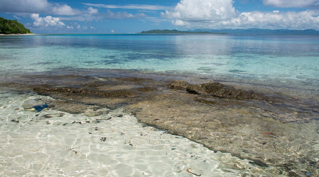 Melanesia, Makira-Ulawa Province, Solomon Islands, island of Owaraha or Owa Raha (formerly known as Santa Ana), village of Gupuna aka Ghupuna. Calm lagoon view with reef.