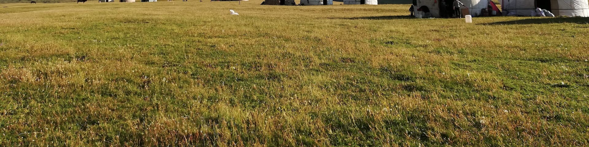 After a 5 hour hike in steep Kyrgyzstan mountains, we finally reach the beautiful lake of Kol'ukok (1970m altitude). The views on the snowy mountain peaks, the lake (just behind me) and the temporary yurts is breathtaking. Definitely worth the climb and well deserved sleep in a yurt at night! Come and see Kyrgyzstan from your own eyes #LifeAtExpediaGroup
