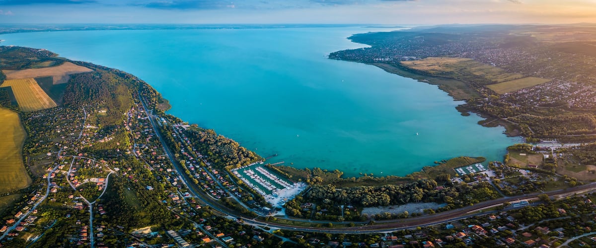 Balatonfuzfo, Hungary - Panoramic aerial skyline view of the north-east corner of Lake Balaton at sunset. This view includes Balatonfuzfo, Balatonalmadi, Balatonkenese and several yacht marinas