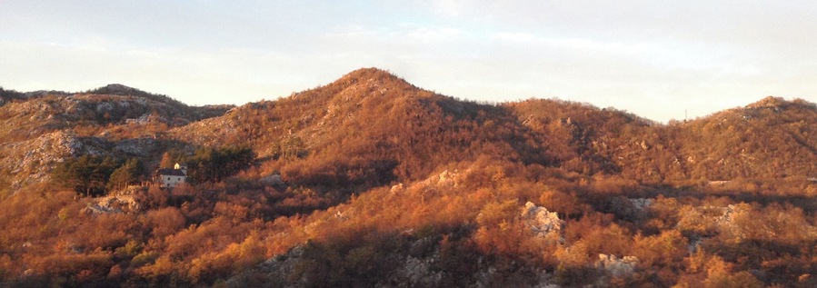 Brajići -ish, in the hills east of Budva, on a bus to Podgorica. The sunrise flushed across rolling hills dotted with farm houses, making the early-even-for-a-morning-person alarm worth every yawn and grumble.