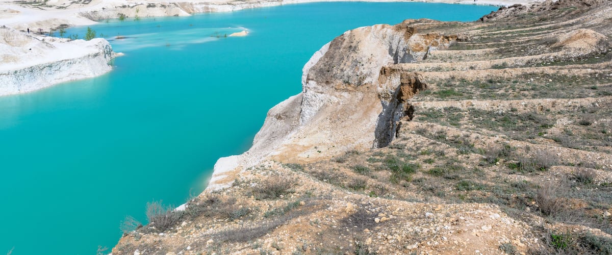 The blue lake, layered mountains, hills of limestone, limestone quarry in the village of West Kazakhstan region.