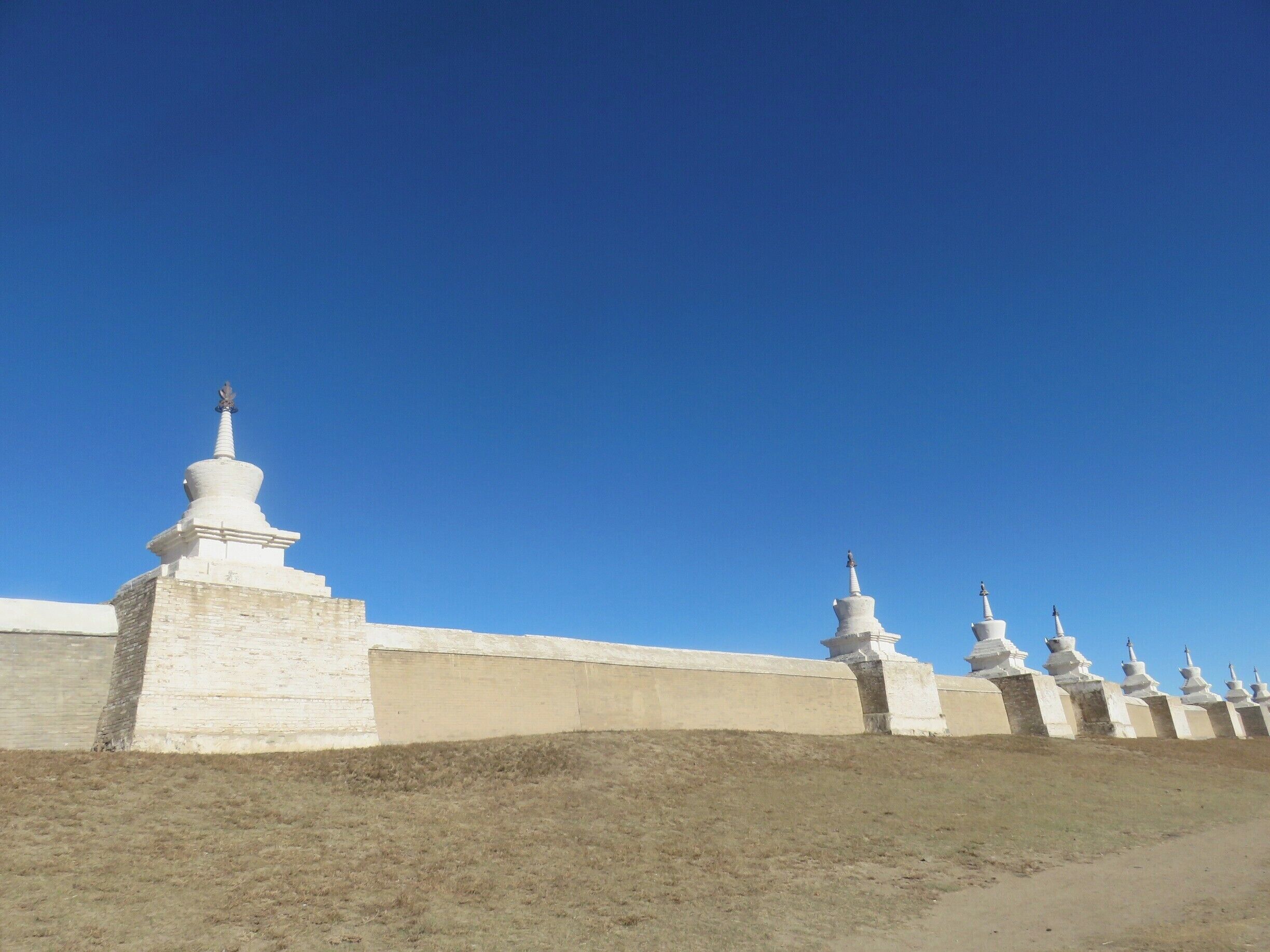 The ancient capital of Chinggis Khan fell into ruins not that long after it was established in the 13th century. His grandson, Kublai Khan moved it to Beijing. The stupas and walls have been recreated from the old stones.