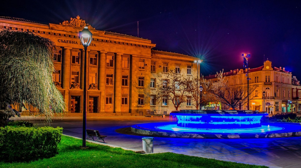 night view of the illuminated building of justice in bulgarian city rousse - ruse.
