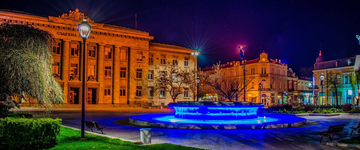 night view of the illuminated building of justice in bulgarian city rousse - ruse.