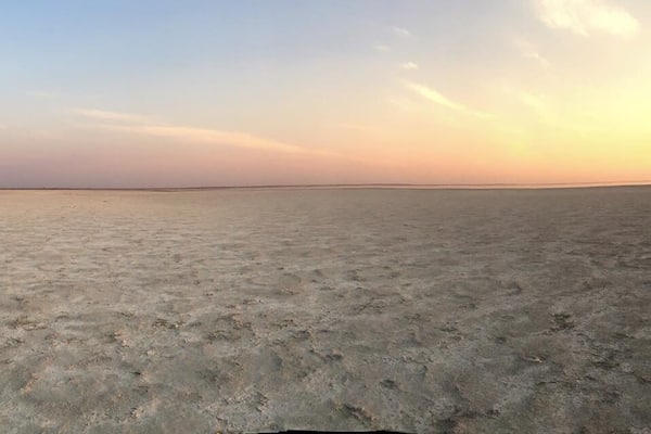 Sunset on the salt pans. Thousands of flamingoes on the horizon. Could mostly hear them rather than see them