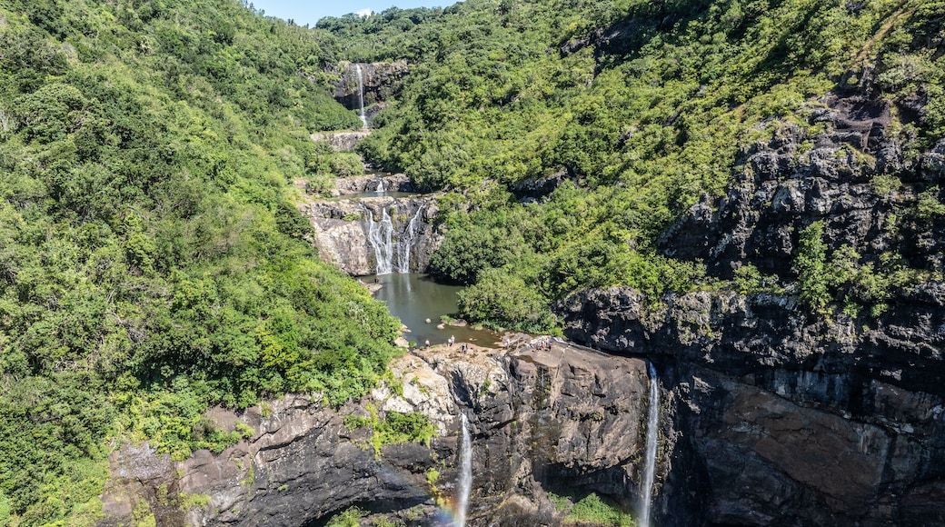 Aerial landscape view of Tamarind Falls, known as Seven Cascades in the tropical island jungle of Mauritius surrounded by lush green forested mountains
