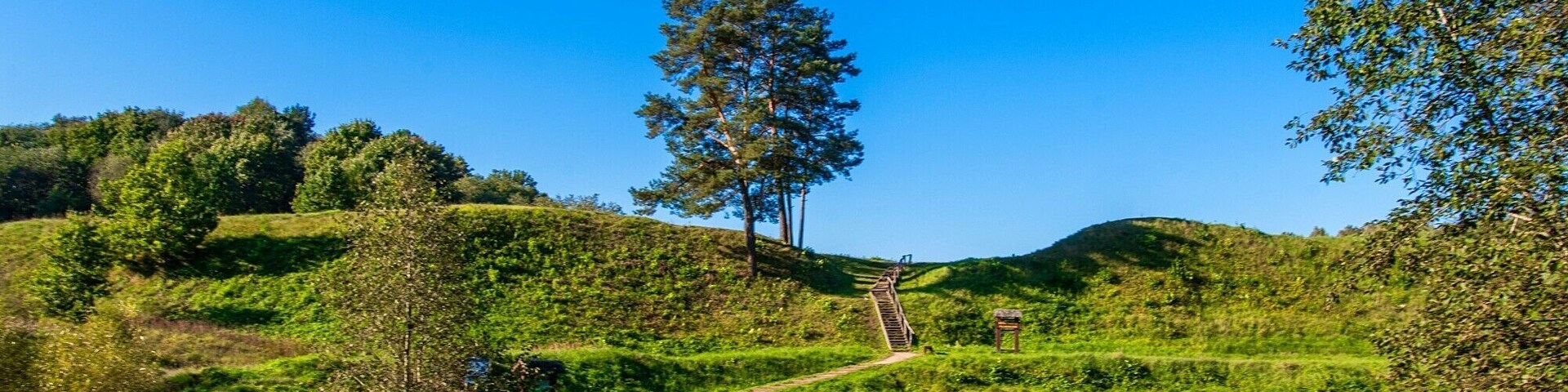 I’ve traveled quite a lot but never seen such an amazing nature as in Lithuania! It is so fantastic that there are so many parks, forests and green spots. I’ve tried to collect as much info as possible before coming to Lithuania and came up with dozens of attractions. One of it is Bradeliskes Hillfort (all tips I found are at "Explore Trakai Vilnius" website). It was the first time for me to discover hillfort – imagine, hundreds of years ago there actually were people protecting their homes from enemies. Here (https://exploretrakaivilnius.lt/en/manors-and-parks/bradeliskes-hill-fort) I found information of this object, for example the hill's surface area equals that of a football pitch and spans more than 110 meters and is 60 meters wide!
