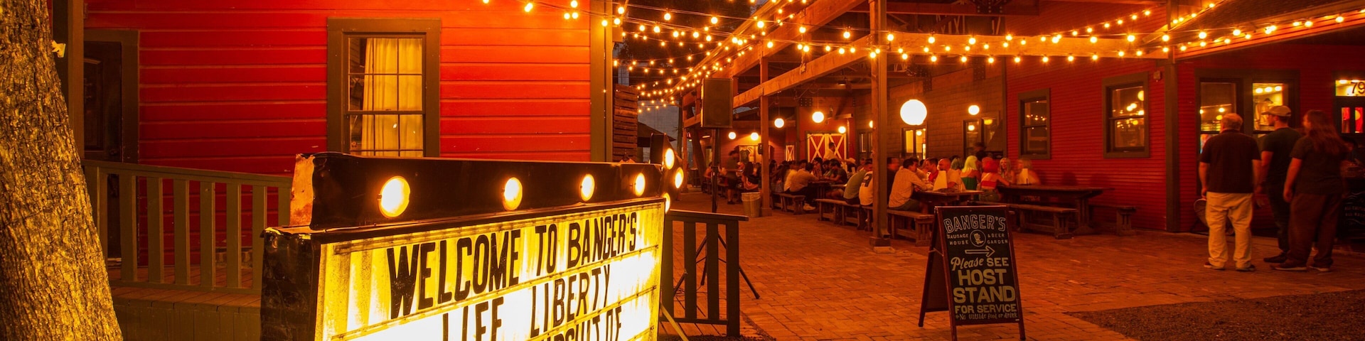 Rainey Street featuring signage, night scenes and nightlife