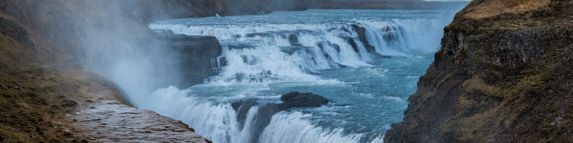 A waterfall cascading down a rocky cliff.