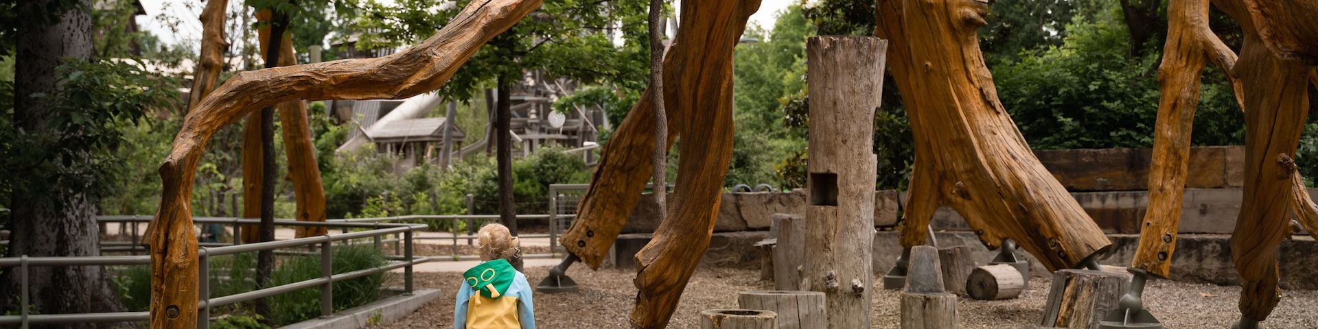 Child Exploring Adventure Playground At Gathering Place In Tulsa