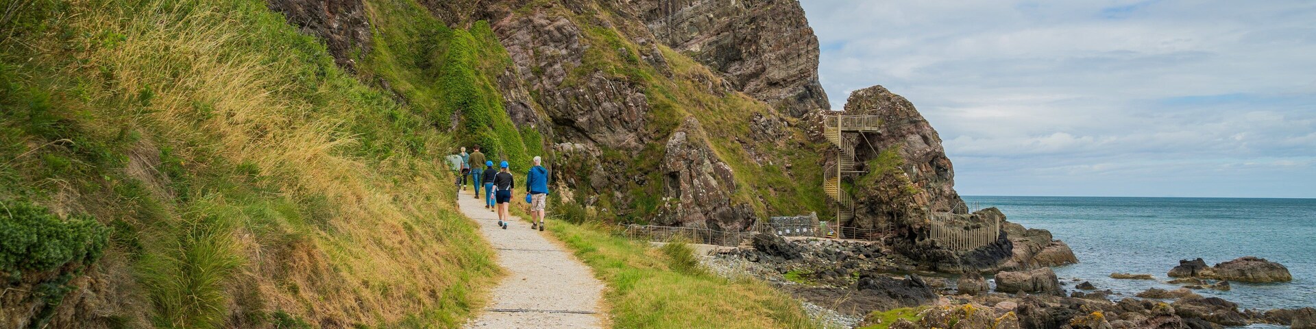 The Gobbins which includes rugged coastline and general coastal views