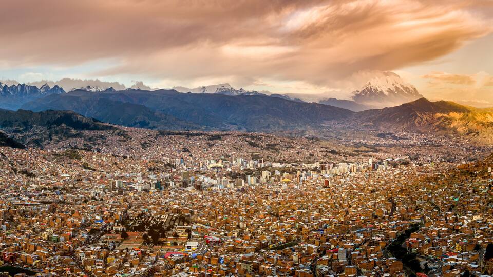 Panoramic HDR photo of the city of La Paz, Bolivia, during sunset with Illimani Mountain rising in the background
