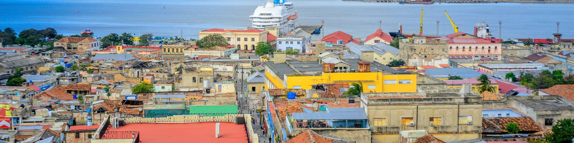view from the air to the old Cuban port city, a large cruise liner stands at the pier