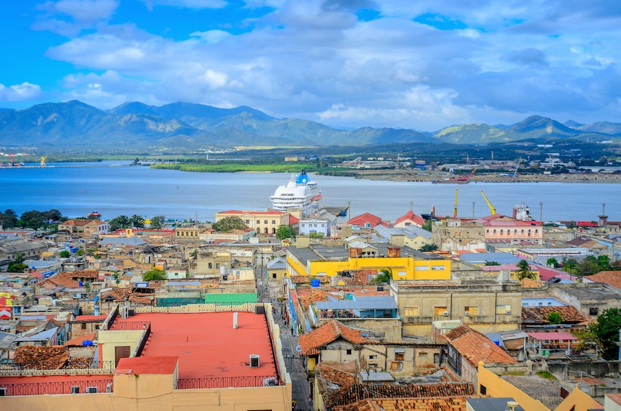 view from the air to the old Cuban port city, a large cruise liner stands at the pier