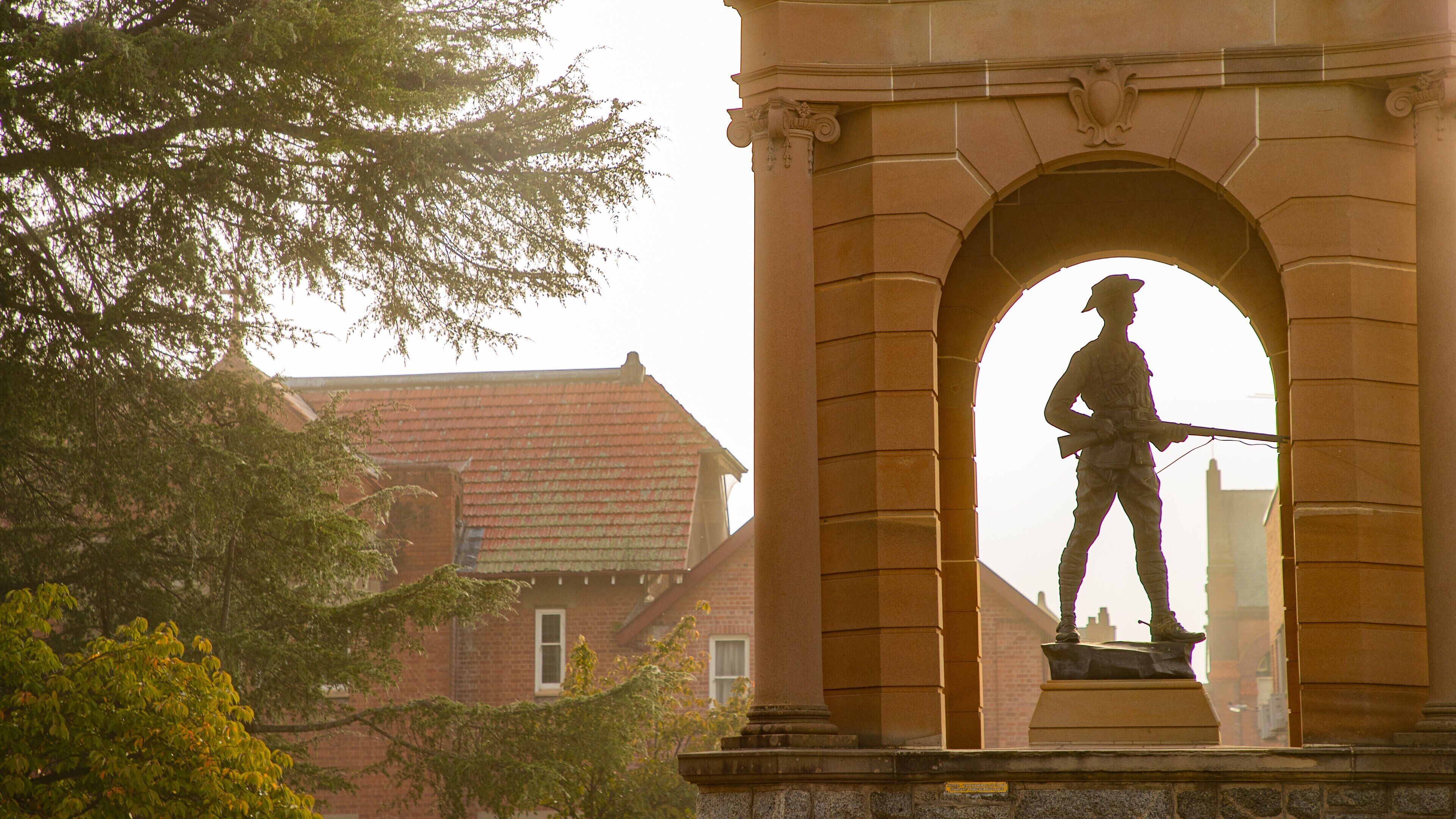 Bathurst War Memorial Carillon showing a statue or sculpture and a sunset